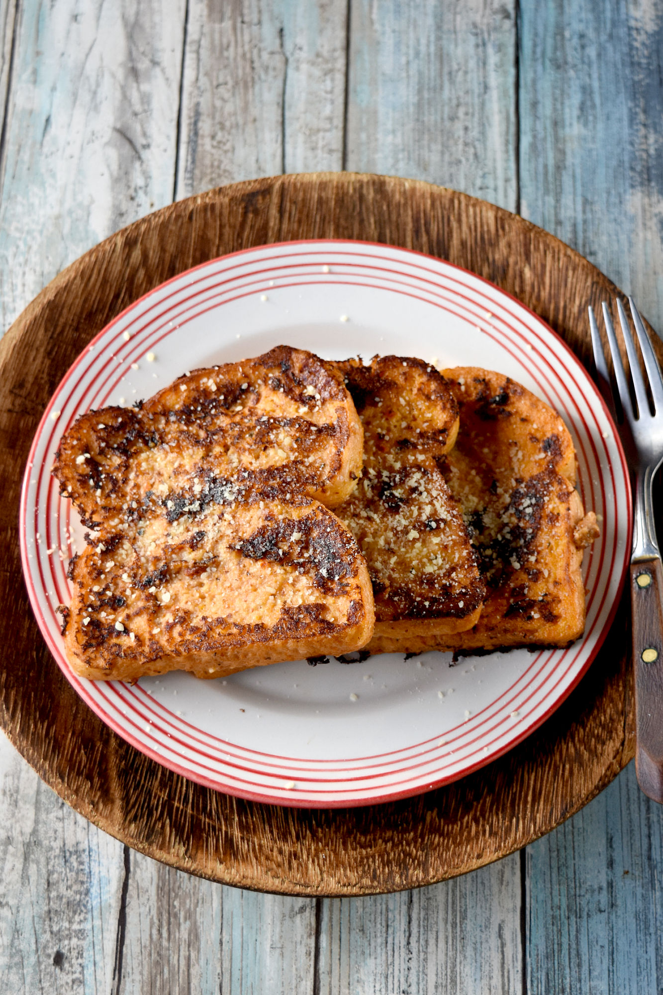 Tomato Pesto French Toast is a savory and delicious French toast with tangy tomato pesto flavor.  You can either make the pesto or use premade pesto for this fun twist on the breakfast classic. #OurFamilyTable #Frenchtoast #tomatopesto #savoryFrenchtoast