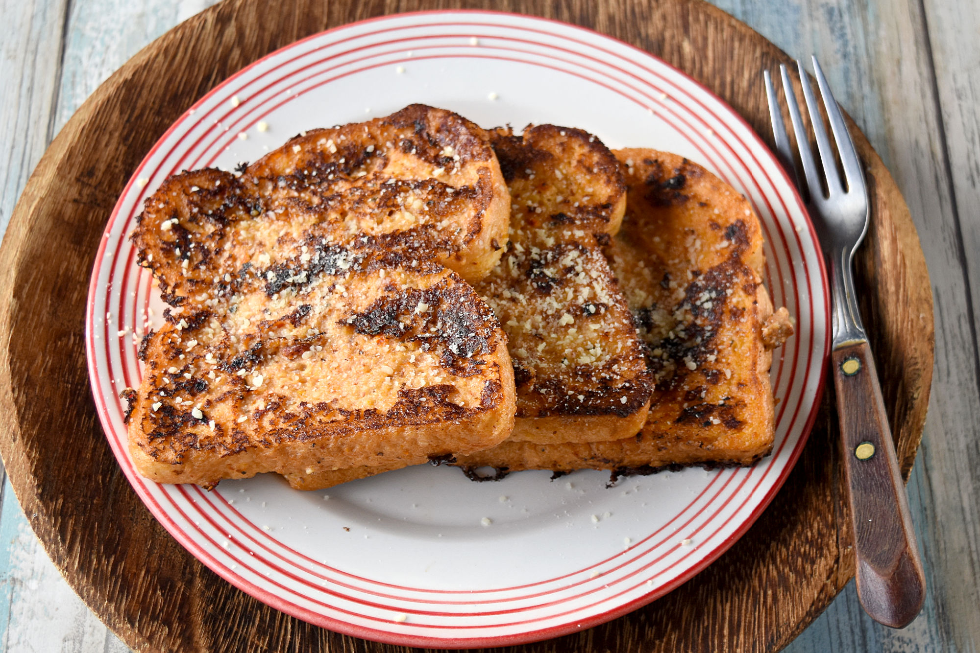 Tomato Pesto French Toast is a savory and delicious French toast with tangy tomato pesto flavor.  You can either make the pesto or use premade pesto for this fun twist on the breakfast classic. #OurFamilyTable #Frenchtoast #tomatopesto #savoryFrenchtoast