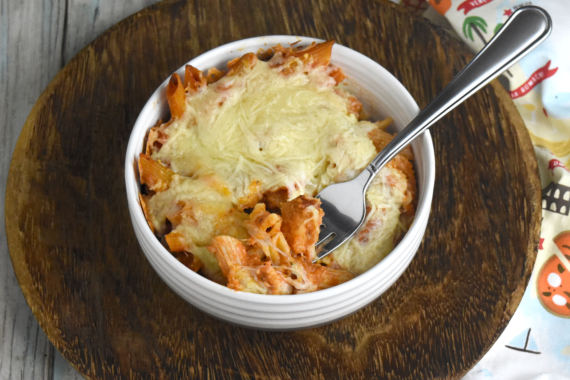 Chicken Parm Pasta Bake is a simple recipe with only five ingredients. But the chicken Parm flavors are all there in this easy and delicious casserole. #OurFamilyTable #chickenParm #casserole #pastadish #bakedpasta