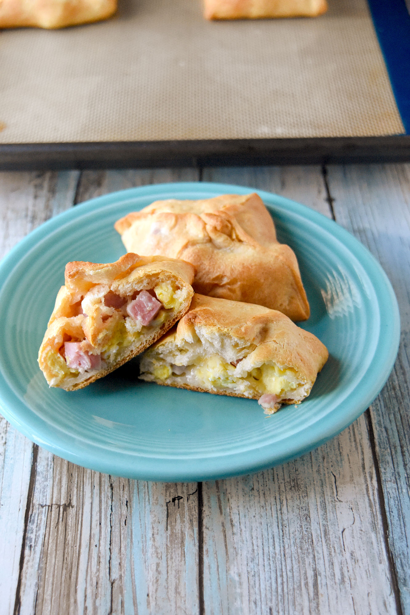 Irish Style Jambon Pastry are pastry pockets filled with cheese and cubes of ham sold at delis across Ireland. They’re the perfect snack, breakfast on the go, or appetizer for your next party. #OurFamilyTable #brunch #Irishfood #breakfast #eggsandcheese #hamandcheese