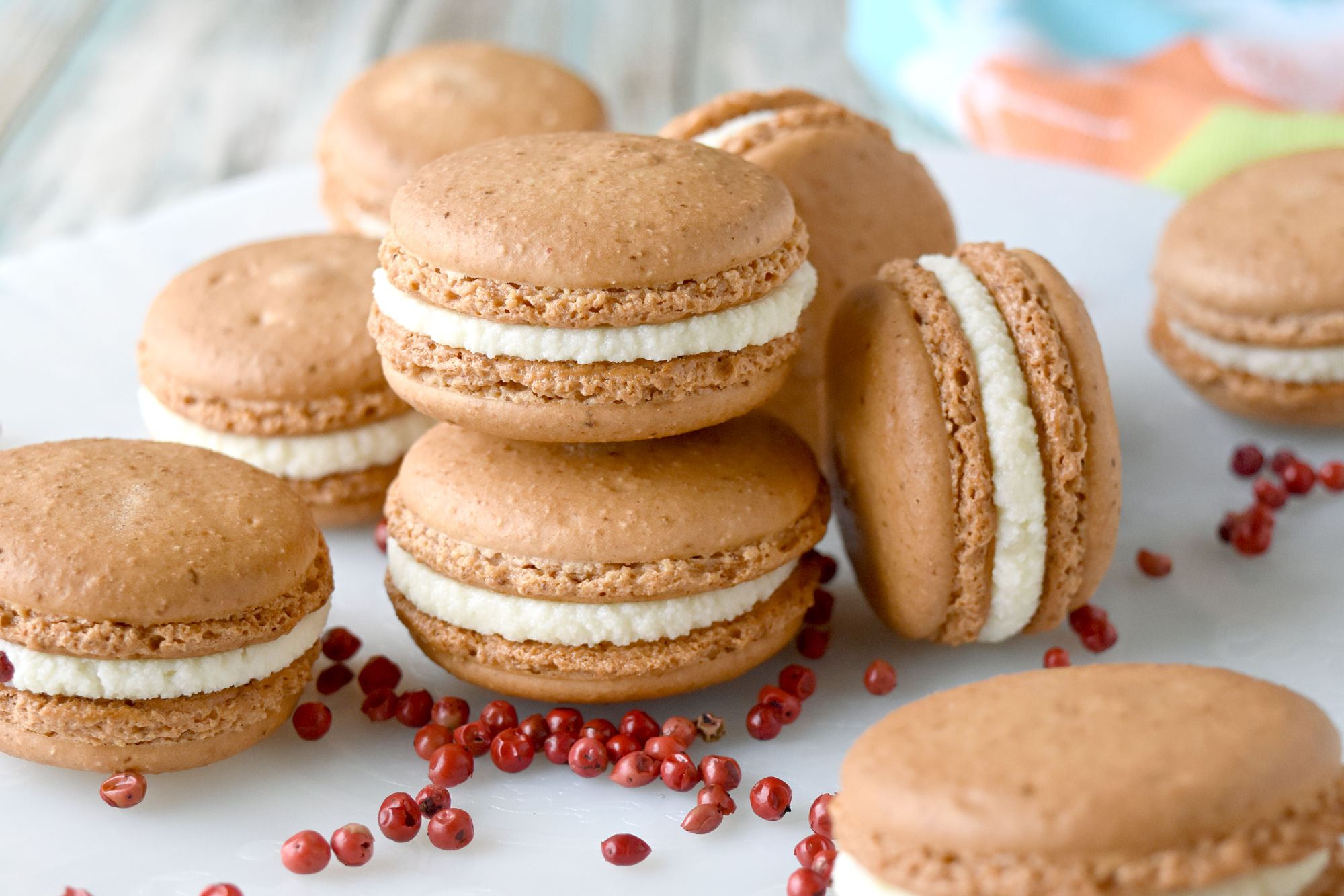 Strawberry Pink Peppercorn Macaron have strawberry and pink peppercorn in the shell. They have the flavor of pepper without the heat making their flavor delicate and delicious. #SpringSweetsWeek #macaronporn #macaronlove #pinkpeppercorns