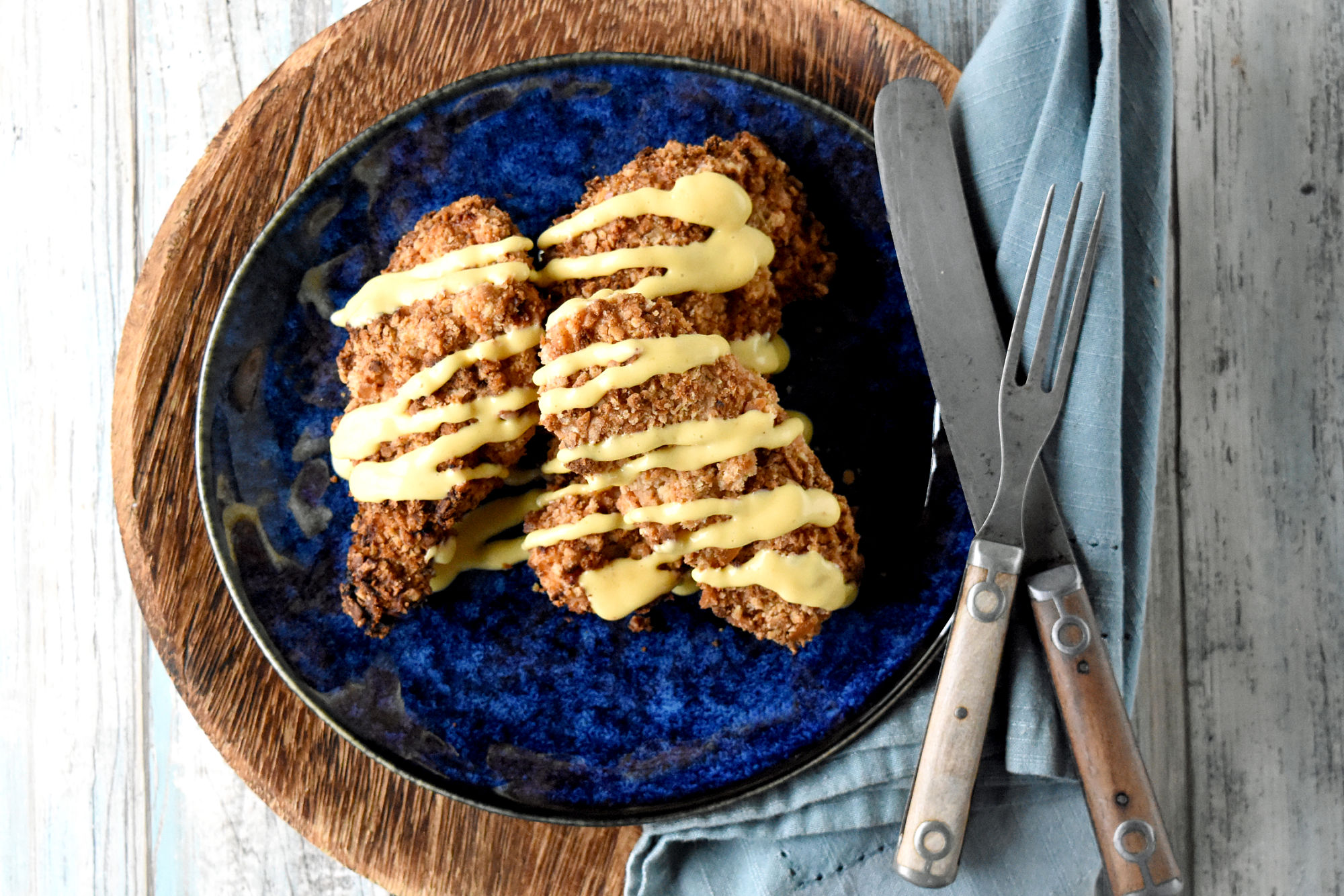 Jalapeno pretzel pieces coat tender chicken in these Jalapeno Pretzel Crusted Chicken Tenders. Cooked in the air fryer with a 3-layer coating technique, they are super crispy and packed with flavor. #OurFamilyTable #appetizer #chickenstrips #jalapenopretzels #pretzelday
