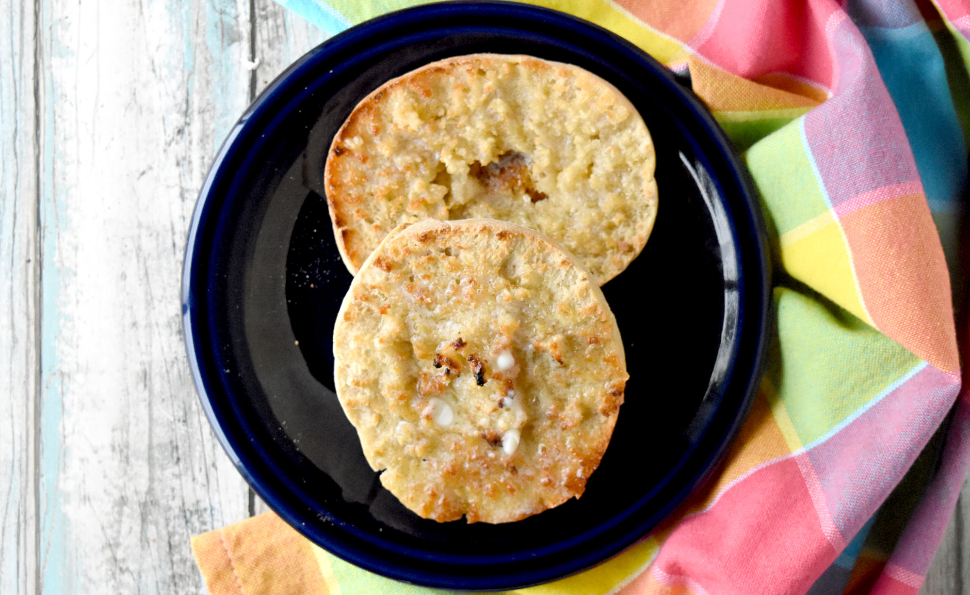 Sourdough English Muffins are easy to make and are a delicious change from your typical breakfast bread. They make the best muffin sandwiches, too! #BrunchWeek #sourdough #sourdoughstarter #discaredrecipe #breadrecipe #Englishmuffins
