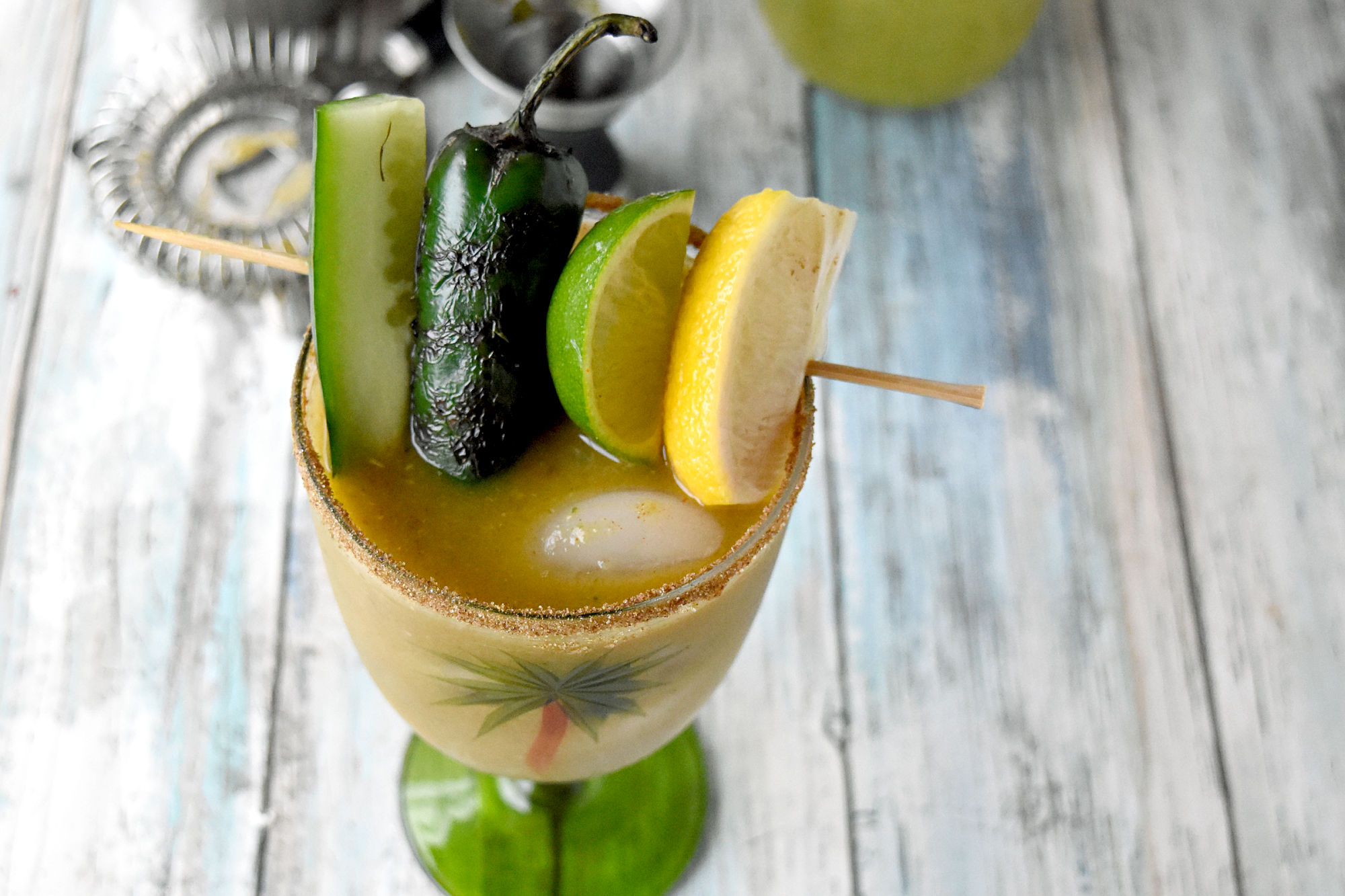 A Verde Mary is a delicious twist on a Bloody Mary! The base is made with tomatillos, jalapenos, green chiles, celery just to name a few green ingredients. #BrunchWeek #bloodyMary #VerdeMary #cocktail
