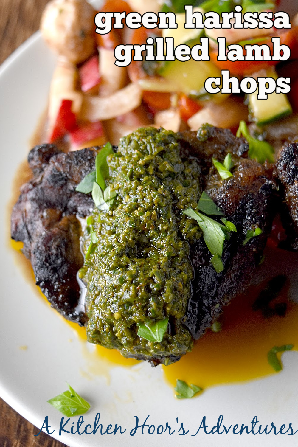 Green Harissa Grilled Lamb Chops have an herb filled delicious sauce with a kick on top of perfectly grilled lamb chops. This green harissa contains spinach, parsley, mint, and oregano and no cilantro. #HerbWeek #greenharissa #grilledlamb #spicysauce #freshherbs
