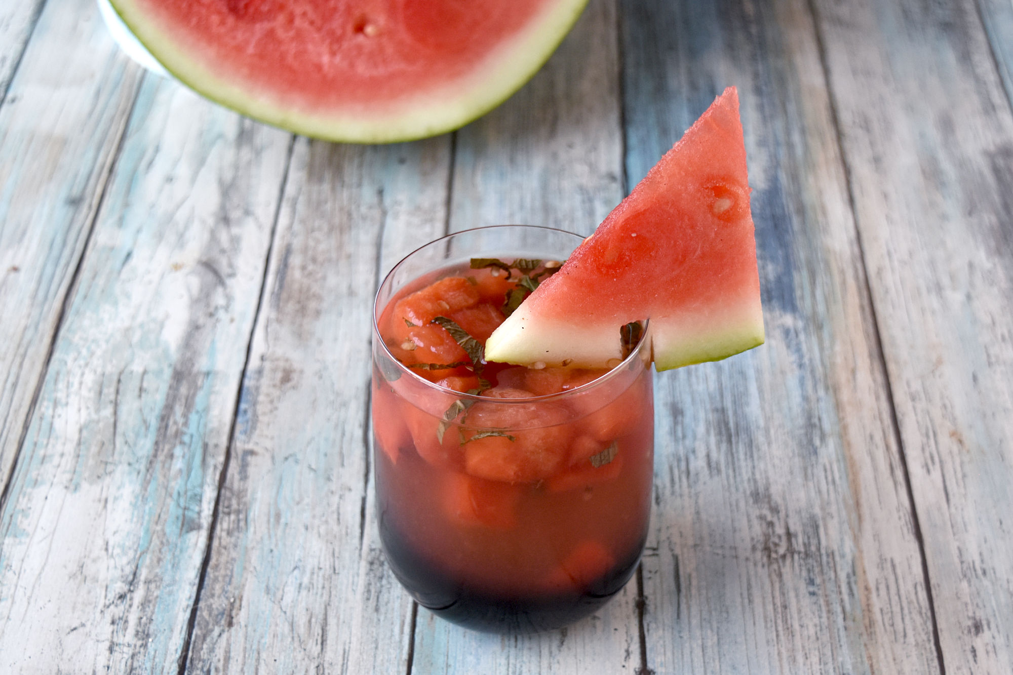 Watermelon Basil Sangria is full of sweet watermelon, vibrant basil, and sweet rosé.  It’s perfectly chilled with plenty of summer flavor to sit poolside, at a backyard party, or sitting on your deck after work. #HerbWeek #sangria #watermelonsangria #freshbasil #rosesangria
