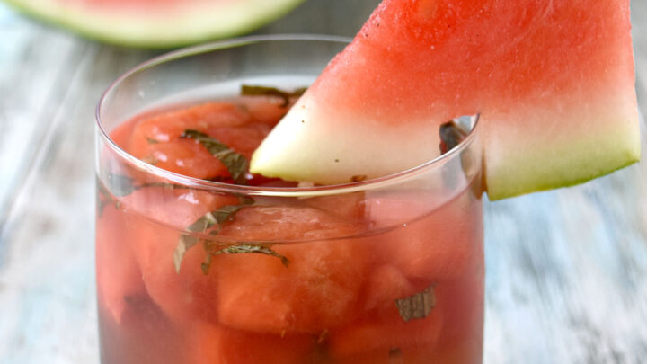 Watermelon Basil Sangria is full of sweet watermelon, vibrant basil, and sweet rosé. It’s perfectly chilled with plenty of summer flavor to sit poolside, at a backyard party, or sitting on your deck after work. #HerbWeek #sangria #watermelonsangria #freshbasil #rosesangria