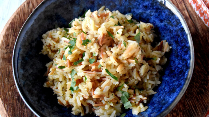 This homemade Rice Pilaf is a feast for the taste buds and the soul. #ComfortFood #OurFamilyTable #ricepilaf #betterthanboxedrice #homemaderice #ricesidedish #HomeCooked #RicePilafLove