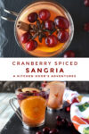 Looking to add a touch of elegance and flavor to your upcoming holiday gathering? This cranberry spiced sangria recipe will leave your guests begging for the recipe and asking for seconds. #CranberryWeek #sangria #wintersangria #spicedsangria #rosesangria