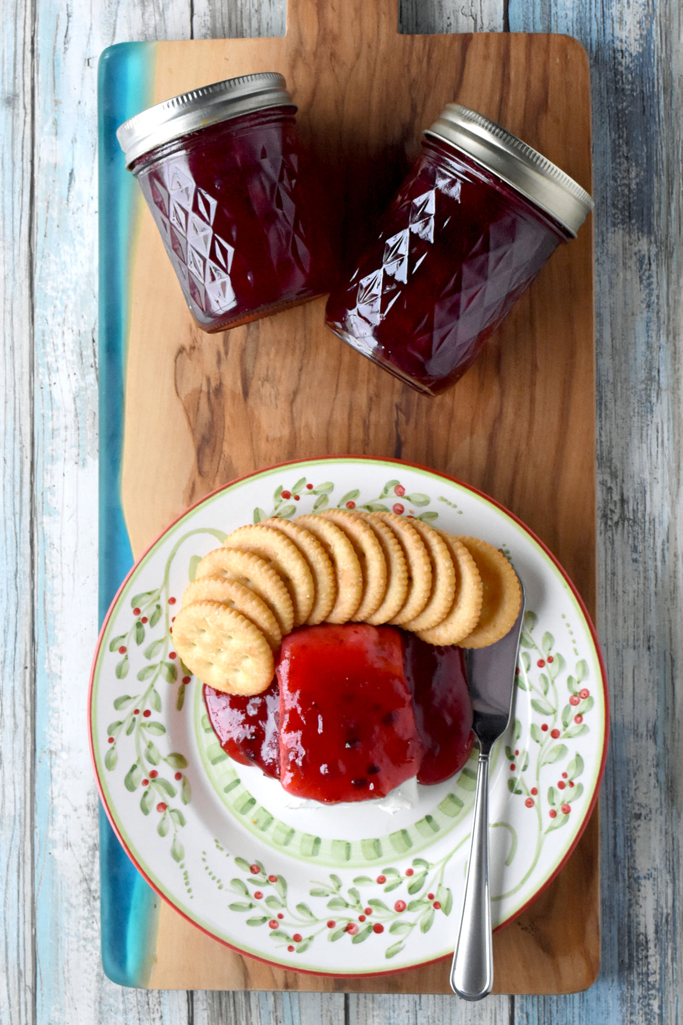 Get ready to spice up your holiday gatherings with this delectable Cranberry Hot Pepper Jelly.  It will have your guests talking and become a must-have on your holiday menu. #CranberryJelly #HotPepperJelly #CranberrySpice #HomemadePreserves #SmallBatchJamsAndJellies
