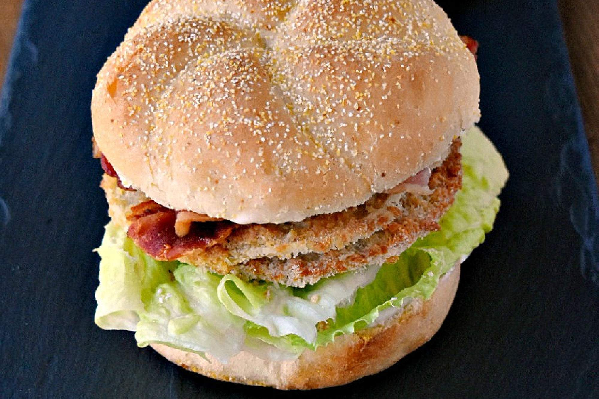 This BLFGT Sandwich has crispy bacon, refreshing lettuce, and tangy fried green tomatoes. It will make your taste buds sing! #BLTdelight #baconloversunite #baconbaconbacon #friedgreentomatolove #sandwichgoals