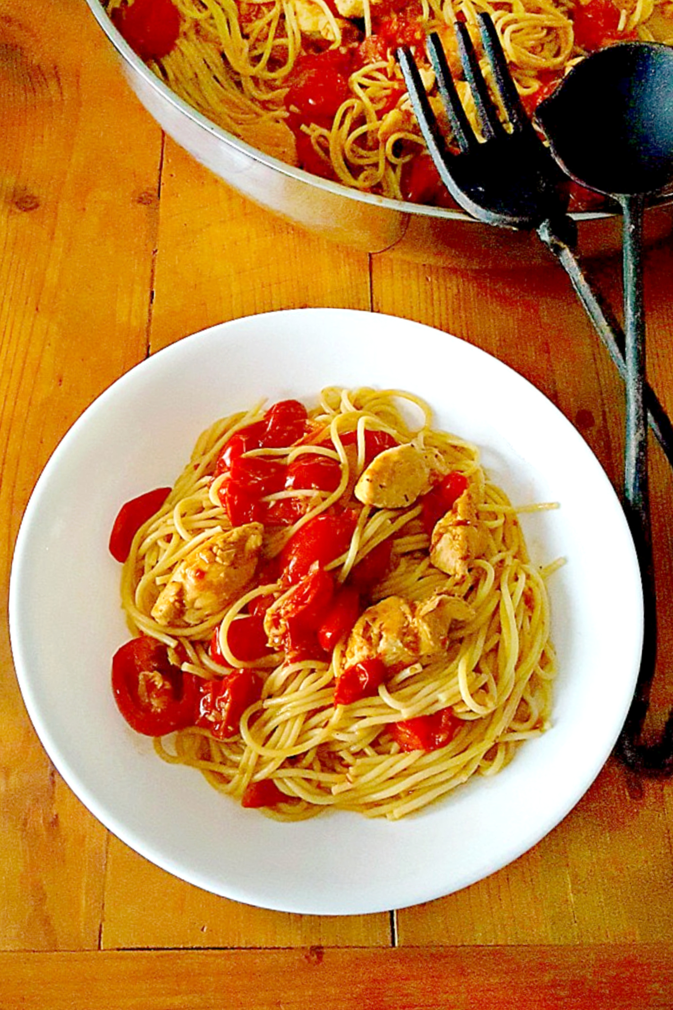Impress your dinner guests with this deceptively simple Blistered Tomato Pasta with Chicken. The blistered tomatoes add a burst of flavor to the tender chicken and al dente pasta. #inseason #freshtomatoes #tomatopasta #chickenrecipe #chickenandpasta #PastaLoversDelight #FoodieFaves #HealthyEats #TomatoObsessed
