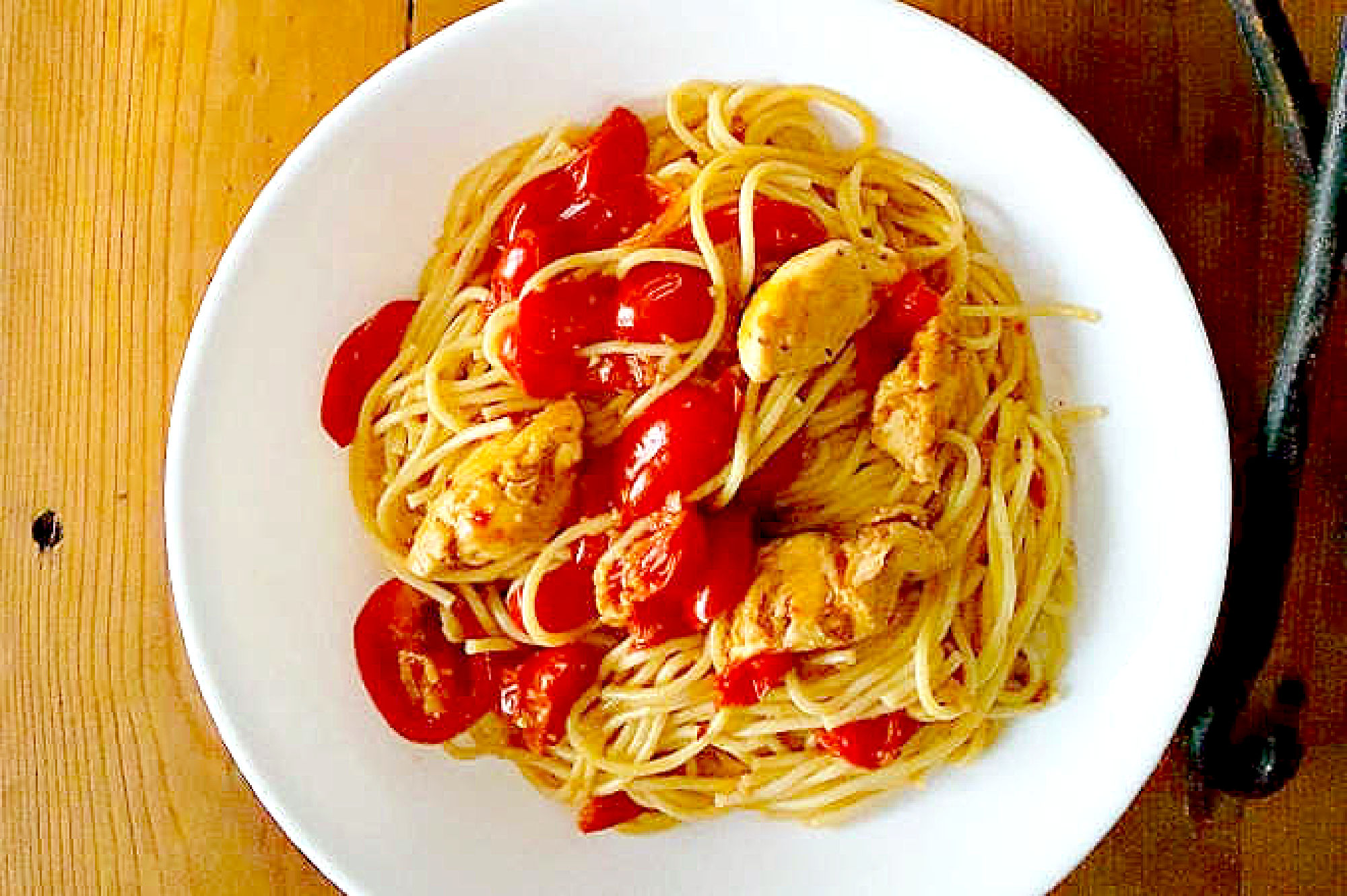 Impress your dinner guests with this deceptively simple Blistered Tomato Pasta with Chicken. The blistered tomatoes add a burst of flavor to the tender chicken and al dente pasta. #inseason #freshtomatoes #tomatopasta #chickenrecipe #chickenandpasta #PastaLoversDelight #FoodieFaves #HealthyEats #TomatoObsessed
