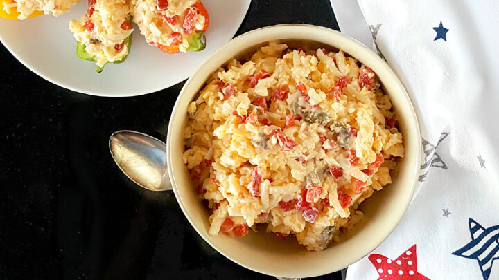 A southern classic, Nana’s Pimento Cheese has one surprise ingredient, but I’ve added another one to make this spread even more tasty. Nana always said the secret to a good pimento cheese is love and a little bit of spice. #PimentoCheesePerfection #CheesyGoodness #FoodieFavorites #GrannyRecipe #NanasPimentoCheese #CheeseLoversUnite #SouthernSavorySpreads #HomemadeGoodness #FamilyRecipeFavorite