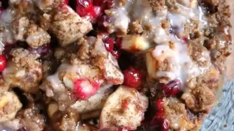 Cranberry cinnamon roll casserole is an easy festive fall breakfast or brunch dish that’s ready in just 30 minutes thanks to a can of refrigerated cinnamon rolls.