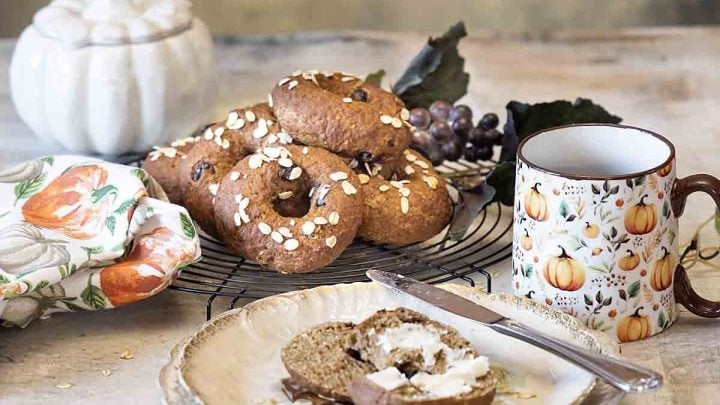 Homemade Pumpkin Bagels with Cranberries is a fun fall treat, made a little healthier with whole grain. Enjoy with pumpkin cream cheese!