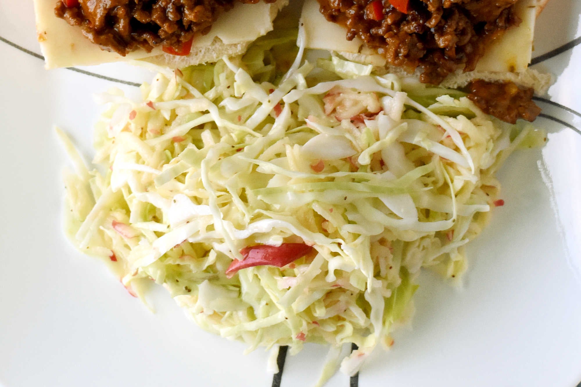 Upgrade your coleslaw game with a crunchy and refreshing easy apple slaw. Perfect for tailgating, potlucks, or as a side dish for any meal.   #HealthyEatsWithEase #NoFussFruitSalad #EffortlessAppleSlaw #QuickAndNutritious #FruitAndVeggieFix