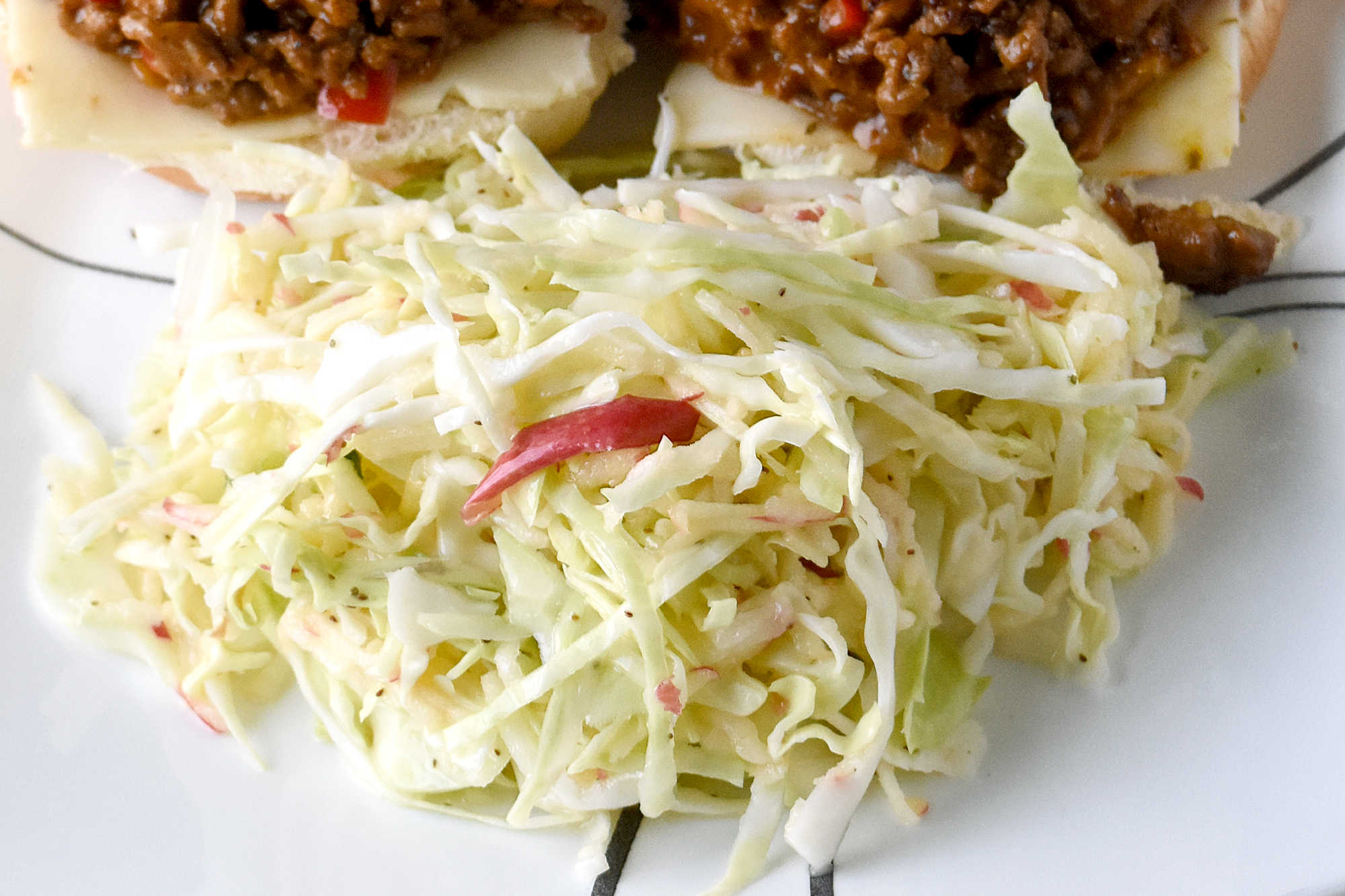 Upgrade your coleslaw game with a crunchy and refreshing easy apple slaw. Perfect for tailgating, potlucks, or as a side dish for any meal. #HealthyEatsWithEase #NoFussFruitSalad #EffortlessAppleSlaw #QuickAndNutritious #FruitAndVeggieFix