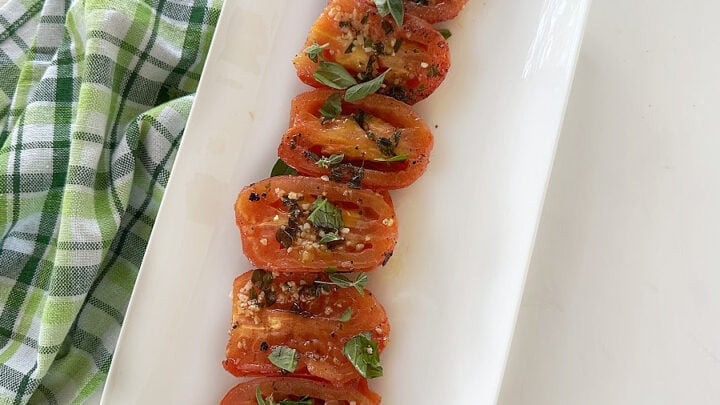 Garlic Grilled Tomatoes highlight the best of fresh summer produce. Grill fresh summer tomatoes that are drizzled with a garlic and herb-infused olive oil to bring out the robust flavors of the tomatoes.