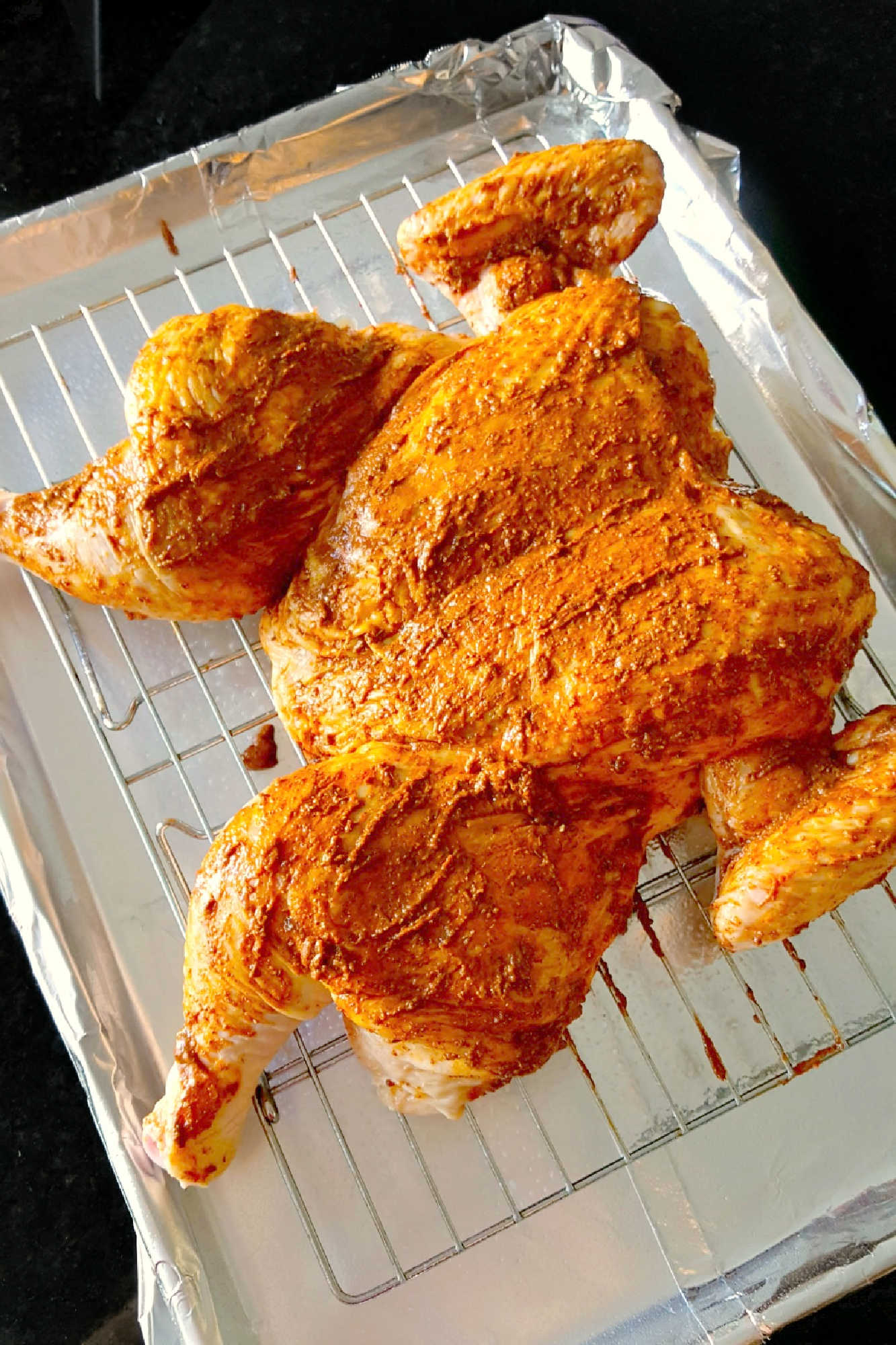 Spice up your weeknight dinner routine with our German Spiced Spatchcocked Chicken. It's quick, easy, and bursting with flavor! Plus, it's a fun way to try a new cooking technique. #spatchcockedchicken #Germanspices #quickdinner #chickendinner #GermanSpices #SpatchcockedChicken #EasyDinnerIdeas #GermanSpicedSpatchcockedChicken  #FlavorfulFowl #DeliciousDinnerIdeas #CookingWithSpices
