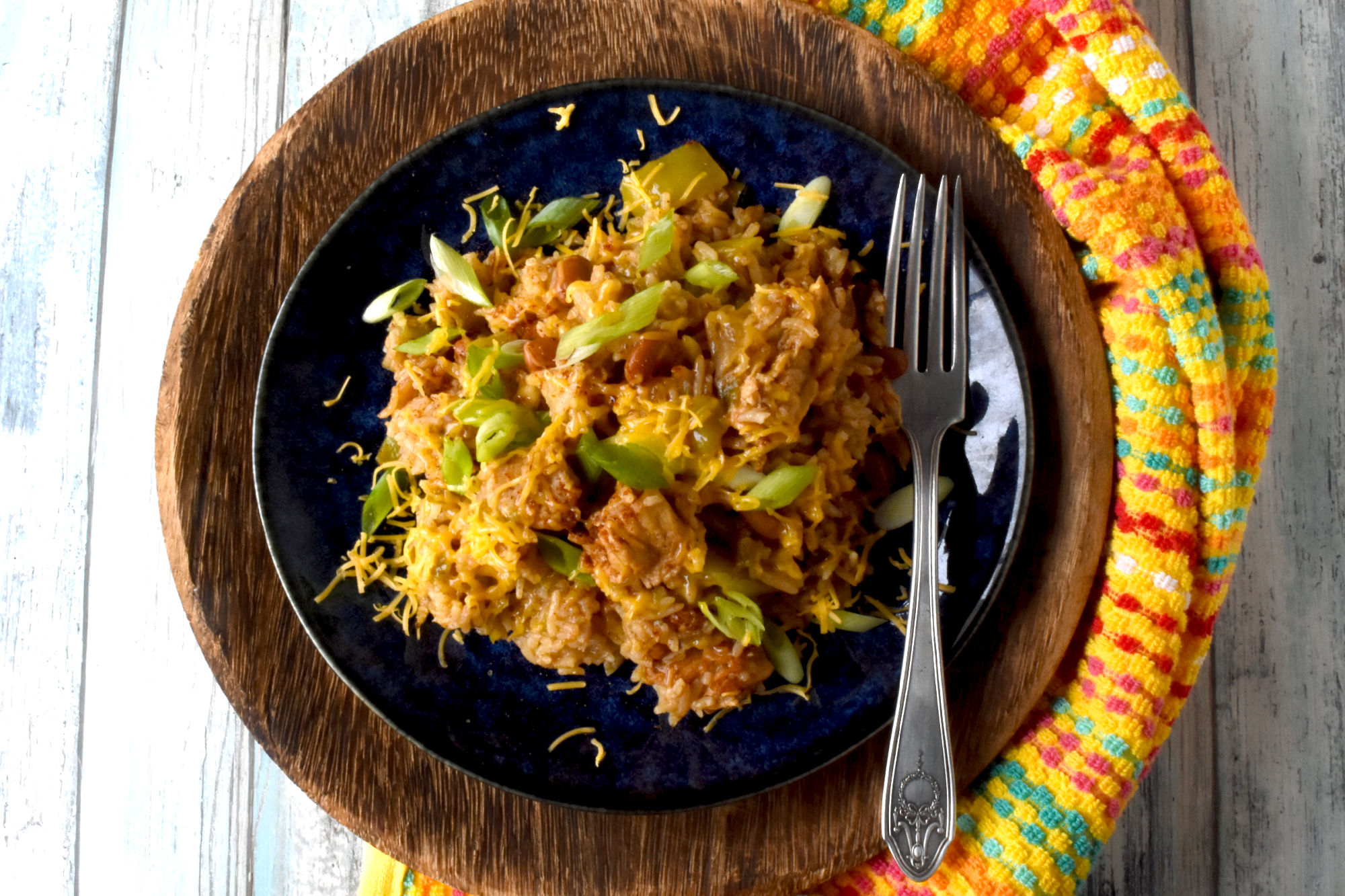 Raise your hand if you love a good one-pot meal! This Green Chile Chicken and Rice is the perfect combination of spicy and savory. Plus it's minimal clean up, maximum flavor! #OurFamilyTable #WeeknightDinner #GreenChileChicken #RiceRecipes #EasyWeeknightDinner #SpicyEats #GreenChileEats #OnePotMeals #SouthwestFlavors #RiceBowls #SpicySatisfaction