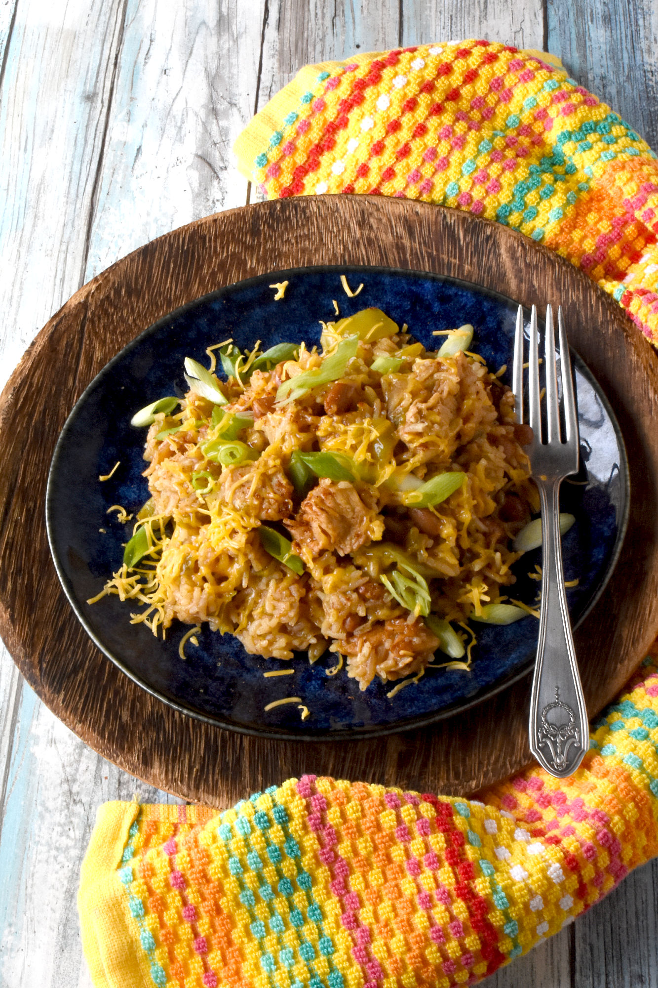 Raise your hand if you love a good one-pot meal! This Green Chile Chicken and Rice is the perfect combination of spicy and savory. Plus it's minimal clean up, maximum flavor! #OurFamilyTable #WeeknightDinner #GreenChileChicken #RiceRecipes #EasyWeeknightDinner #SpicyEats #GreenChileEats #OnePotMeals #SouthwestFlavors #RiceBowls #SpicySatisfaction