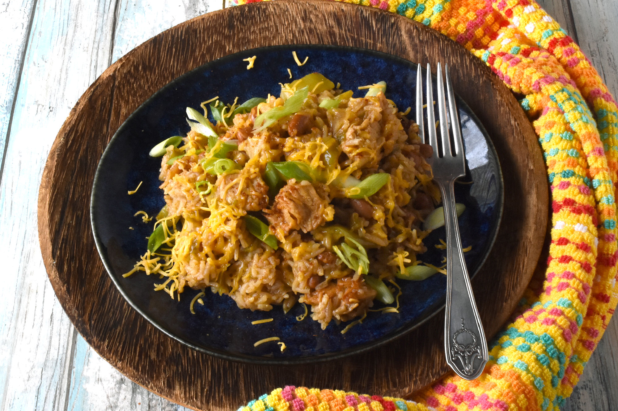 Raise your hand if you love a good one-pot meal! This Green Chile Chicken and Rice is the perfect combination of spicy and savory. Plus it's minimal clean up, maximum flavor! #OurFamilyTable #WeeknightDinner #GreenChileChicken #RiceRecipes #EasyWeeknightDinner #SpicyEats #GreenChileEats #OnePotMeals #SouthwestFlavors #RiceBowls #SpicySatisfaction