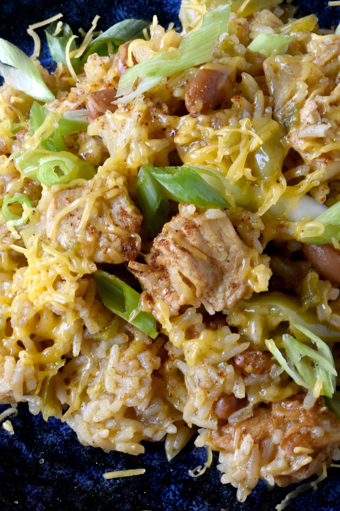 Raise your hand if you love a good one-pot meal! This Green Chile Chicken and Rice is the perfect combination of spicy and savory. Plus it's minimal clean up, maximum flavor! #OurFamilyTable #WeeknightDinner #GreenChileChicken #RiceRecipes #EasyWeeknightDinner #SpicyEats #GreenChileEats #OnePotMeals #SouthwestFlavors #RiceBowls #SpicySatisfaction