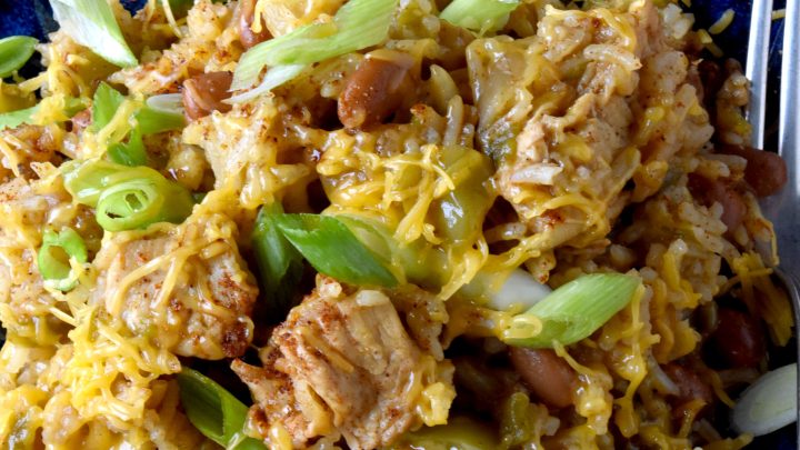 Raise your hand if you love a good one-pot meal! This Green Chile Chicken and Rice is the perfect combination of spicy and savory. Plus it's minimal clean up, maximum flavor! #OurFamilyTable #WeeknightDinner #GreenChileChicken #RiceRecipes #EasyWeeknightDinner #SpicyEats #GreenChileEats #OnePotMeals #SouthwestFlavors #RiceBowls #SpicySatisfaction