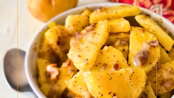 Hot German Potato Salad is a simple potato side dish with a sweet and tangy sauce loaded with bacon and celery seeds. Great with chicken, pork, bratwurst and more.