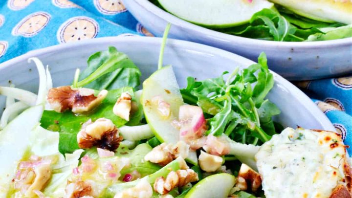 This arugula, apple, and fennel salad is tossed with a wonderful citrus dressing and served with toasty crostini topped with a melty three-cheese spread.