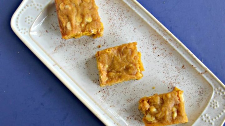 Decadent pumpkin blondies are bursting with flavor from spices and sweetened with white chocolate chips make the perfect fall treat.