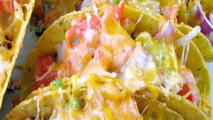 These easy to make, customizable, and prepare ahead of time, Cheesy Baked Breakfast Tacos are perfect for brunch or breakfast for dinner.