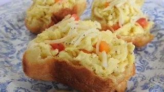 Try our fluffy popovers filled with cheesy scrambled eggs. They're a delicious brunch dish that’s sure to impress your guests!