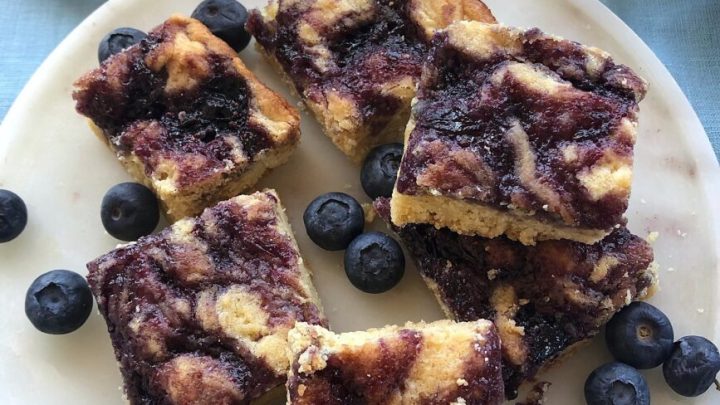 Blueberry Blondies take delicate vanilla blondies and swirls in fresh blueberry jam. A taste of spring in every bite!