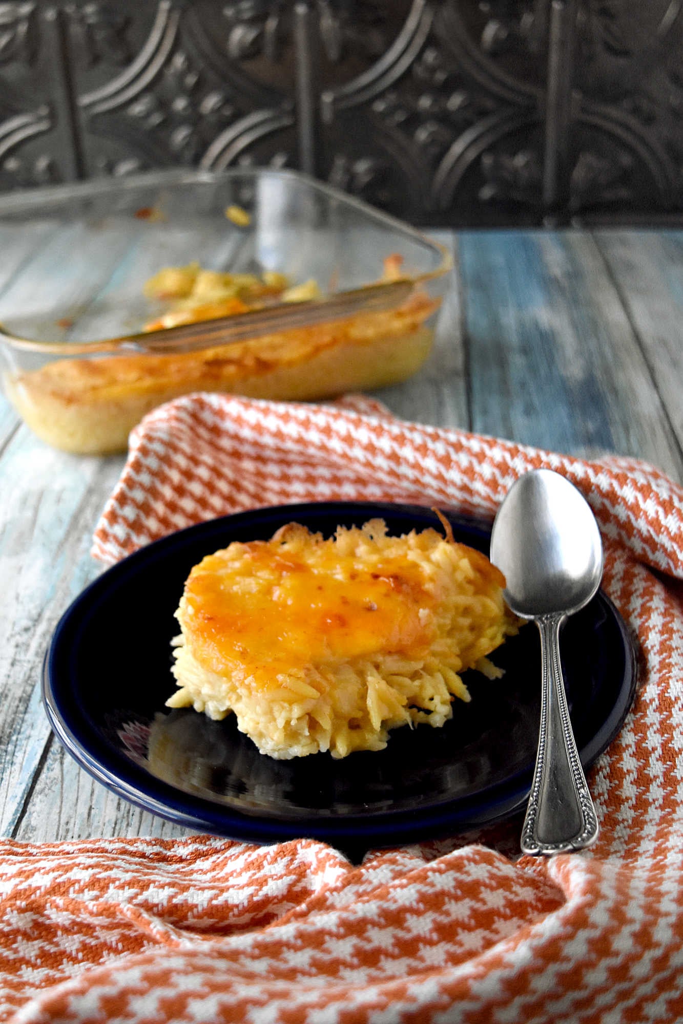 Take your cooking skills to the next level with Creamy Baked Orzo. Discover how this simple yet flavorful dish can add sophistication and elegance to your meals.  It will impess even the most discerning palates. #OrzoObsessed #CreamyComfortFood #OnePotWonders #ItalianInspiredEats #PastaPerfection