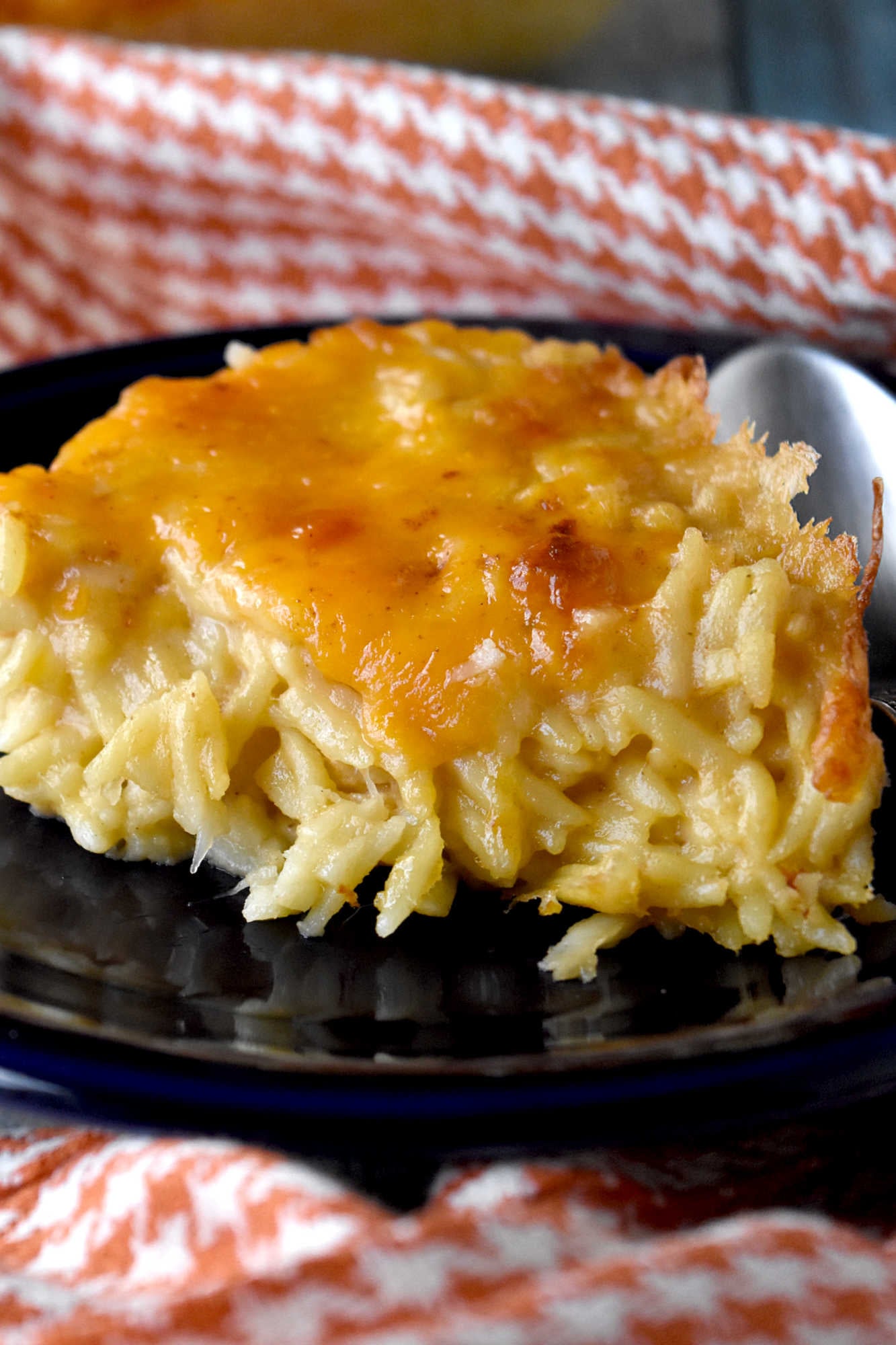 Take your cooking skills to the next level with Creamy Baked Orzo. Discover how this simple yet flavorful dish can add sophistication and elegance to your meals.  It will impess even the most discerning palates. #OrzoObsessed #CreamyComfortFood #OnePotWonders #ItalianInspiredEats #PastaPerfection