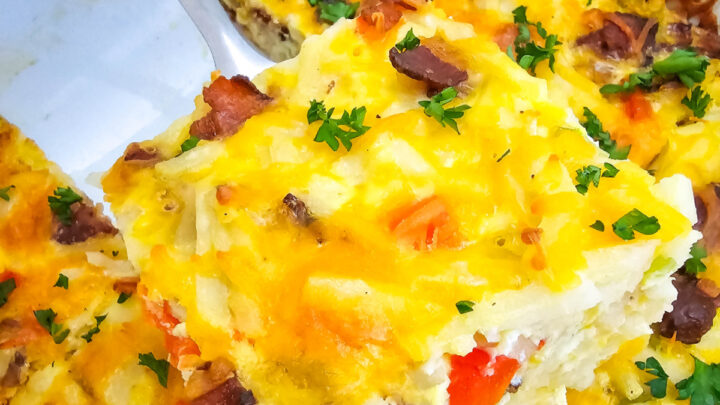 Features a layer of shredded hashbrowns, crisp bacon, colorful bell peppers, and plenty of cheddar cheese all baked to golden perfection with a rich egg custard mixture.