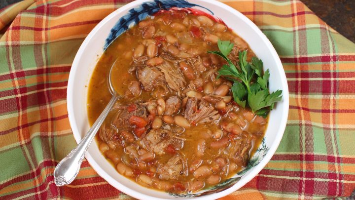 Delicious Soup Beans with Roast Pork combines left over pork with pinto beans and back fat to make a nice brothy soup or main course.