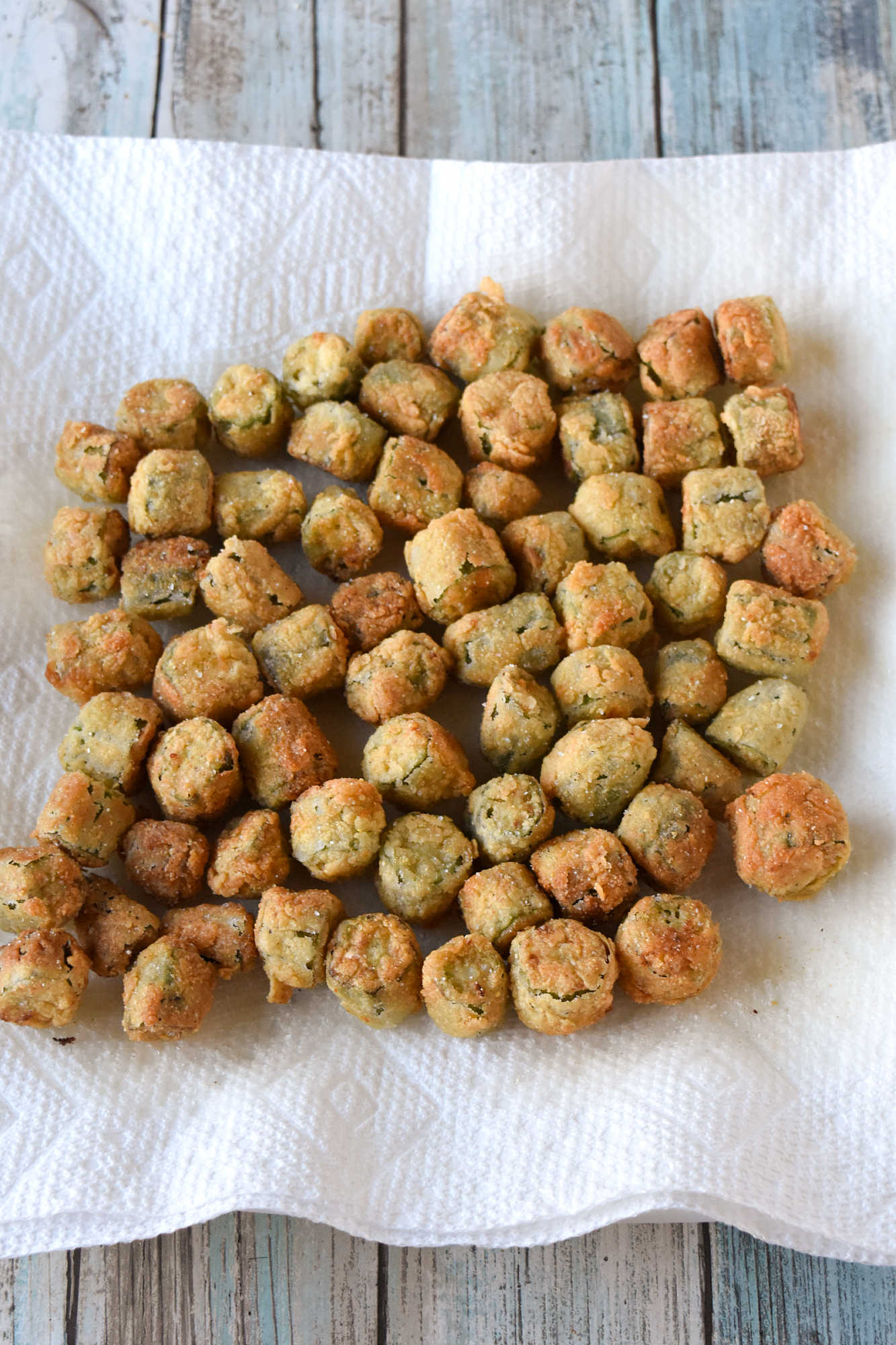 Crispy southern fried okra instantly brings a touch of southern charm to your table. These crunchy, golden bites are the perfect excuse to linger a little longer around the holiday table. #HolidaySideDish #southernfoodlove #okralove #friedfoodheaven #southernfavourites #southerncookingdelights