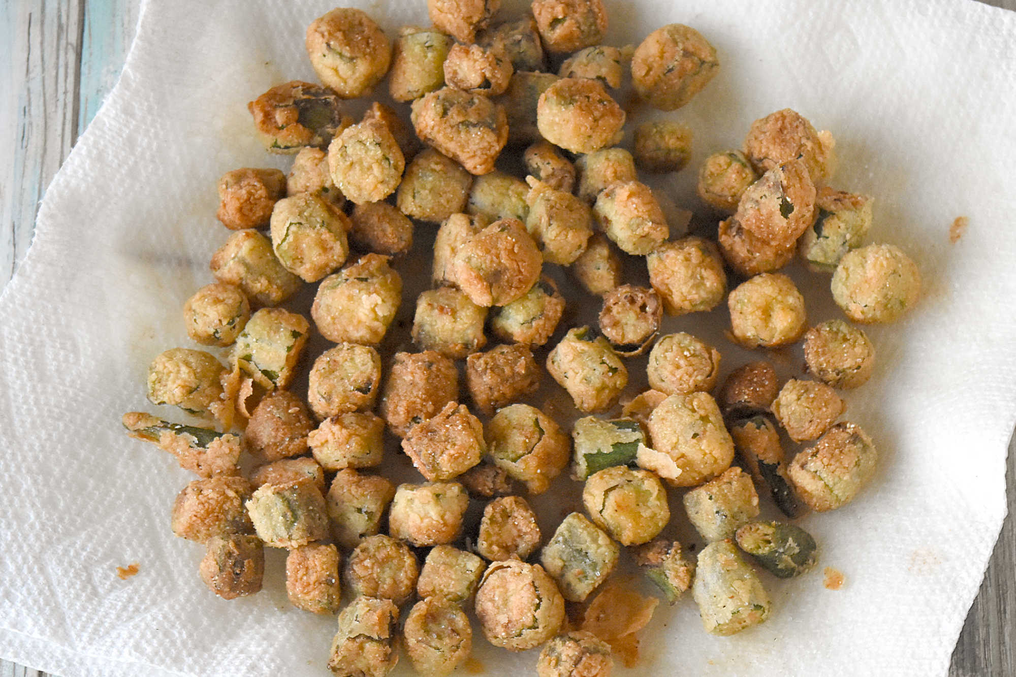 Crispy southern fried okra instantly brings a touch of southern charm to your table. These crunchy, golden bites are the perfect excuse to linger a little longer around the holiday table. #HolidaySideDish #southernfoodlove #okralove #friedfoodheaven #southernfavourites #southerncookingdelights