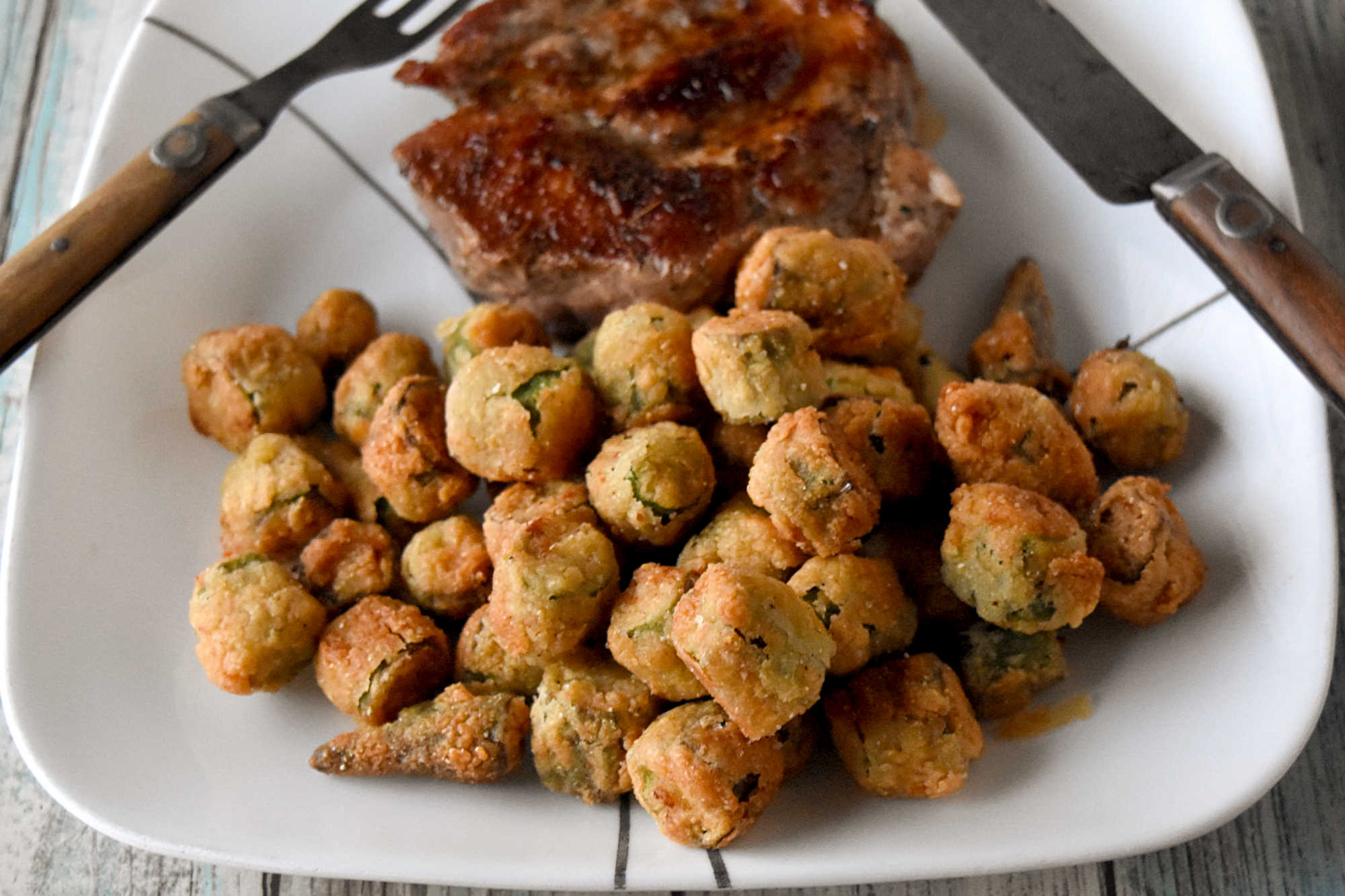 Crispy southern fried okra instantly brings a touch of southern charm to your table. These crunchy, golden bites are the perfect excuse to linger a little longer around the holiday table. #HolidaySideDish #southernfoodlove #okralove #friedfoodheaven #southernfavourites #southerncookingdelights