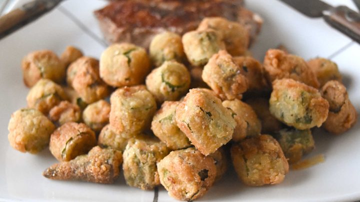 Crispy southern fried okra instantly brings a touch of southern charm to your table. These crunchy, golden bites are the perfect excuse to linger a little longer around the holiday table. #HolidaySideDish #southernfoodlove #okralove #friedfoodheaven #southernfavourites #southerncookingdelights