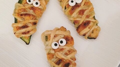 Get ready for Halloween with these fun Mummy Jalapeño Poppers! A deliciously cheesy and spicy treat that's perfect for your holiday celebrations!