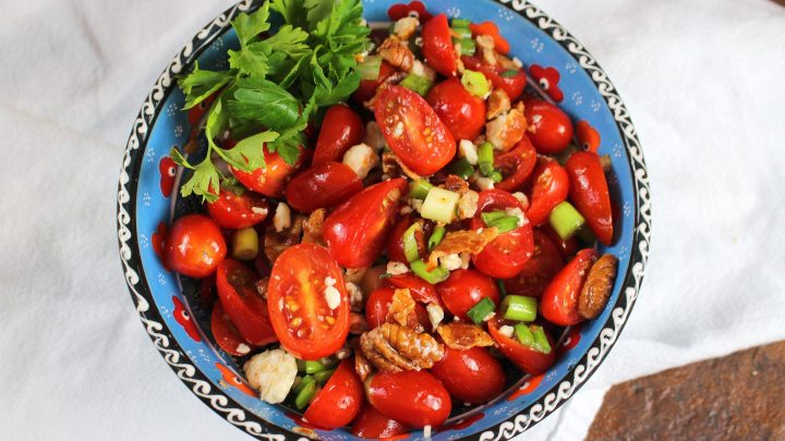 Bacon Blue Cheese and Tomato Salad, a variation on a traditional tomato salad, also can be used as a topping for an iceberg wedge salad.