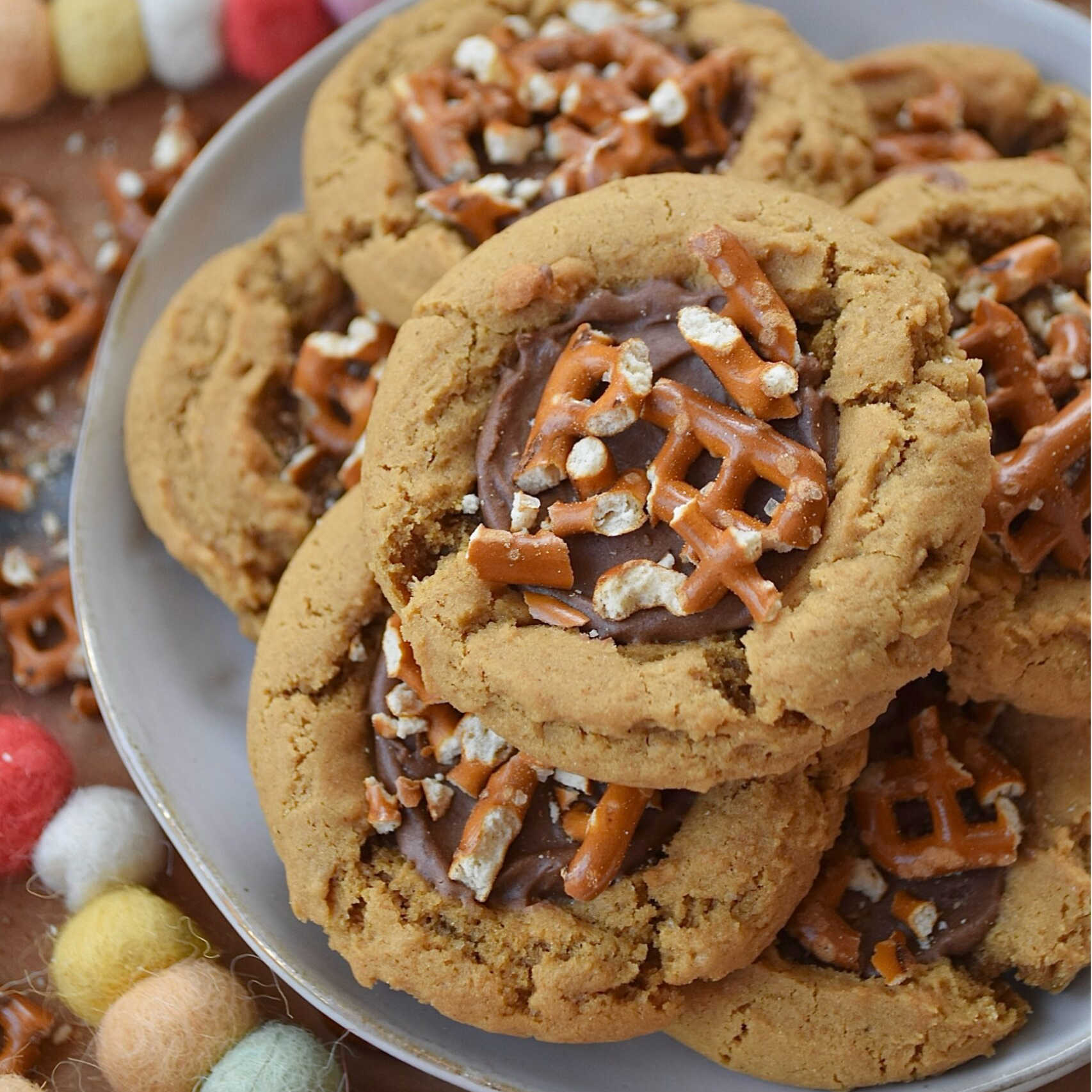 These cocoa-iced cookies with pretzels are everything you’ve ever wanted in a single treat. Get ready to fall in love.