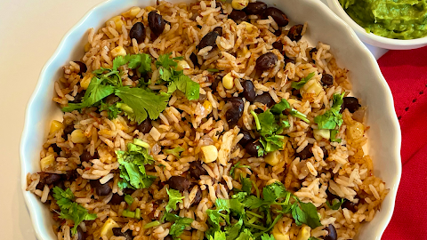 This is a quick and easy one pot Mexican style beans and rice made in Instant Pot. This vegan meal requires only minimal sauce, and can be put together in 30 minutes and is super simple to make.
