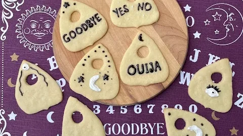 Conjure up some deliciously spooky cookies for a Halloween party or scary movie night with these Ouija board planchette cookies.