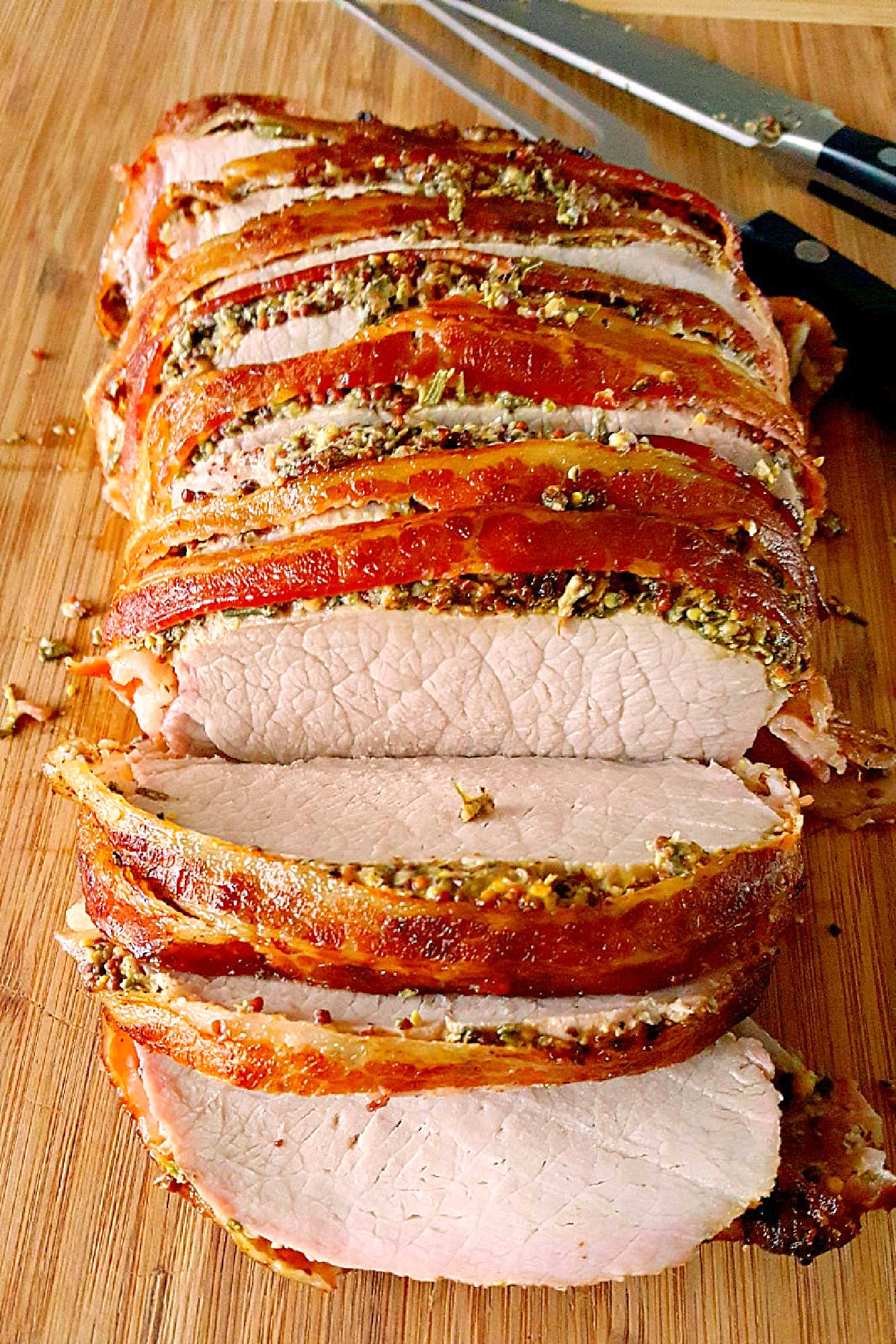 Experience layers of flavor with our Bacon Wellington Pork Roast, where savory bacon wraps perfectly seasoned pork tenderloin for an unforgettable meal. Indulge in the ultimate comfort food.  #OurFamilyTable #BaconWellington #PorkRoast #DeliciousDinner #FoodieFaves #WeeknightMeals