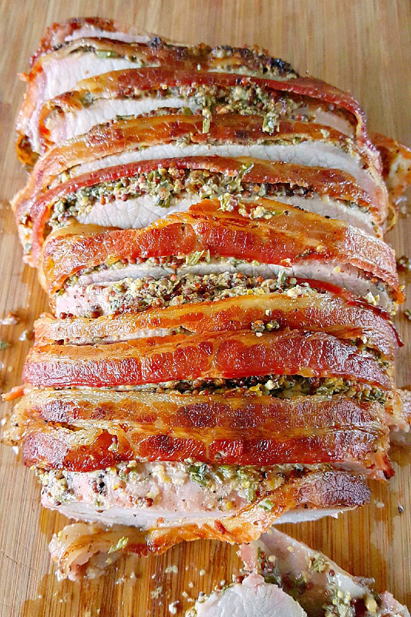 Experience layers of flavor with our Bacon Wellington Pork Roast, where savory bacon wraps perfectly seasoned pork tenderloin for an unforgettable meal. Indulge in the ultimate comfort food.  #OurFamilyTable #BaconWellington #PorkRoast #DeliciousDinner #FoodieFaves #WeeknightMeals